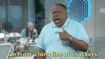 Cedric the Entertainer in a light polo shirt says, &quot;I&#x27;m from a long line of snackers.&quot; People are seen working in the background